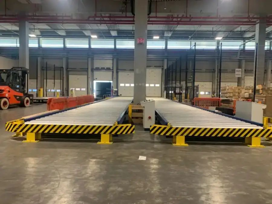 Two roller decks with yellow and black safety edging in the WFS cargo warehouse at Brussels International Airport, Belgium
